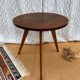 Pretty little vintage round table with tapered legs.