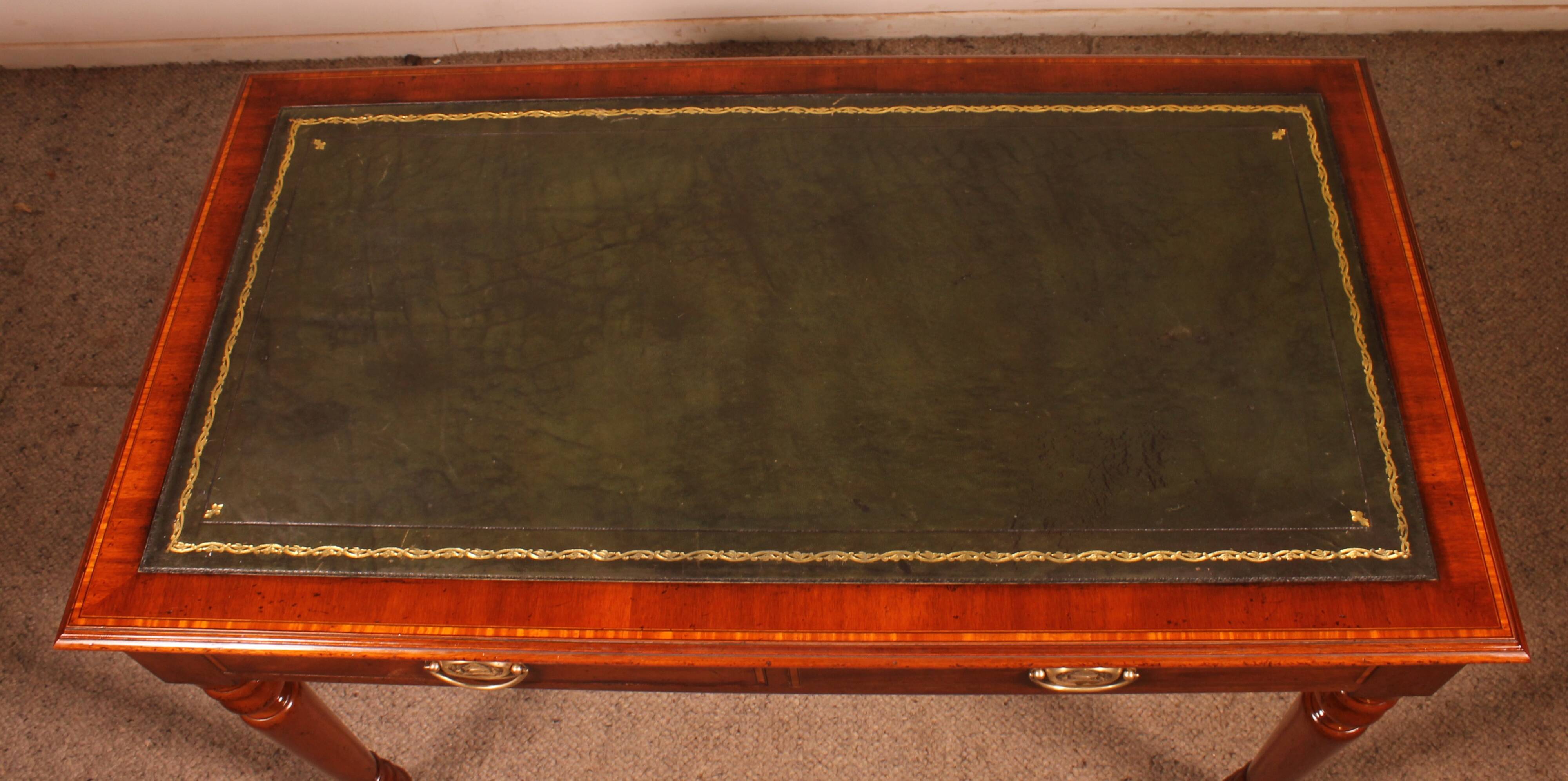 flat desk with two drawers from the 19th century in mahogany and inlays