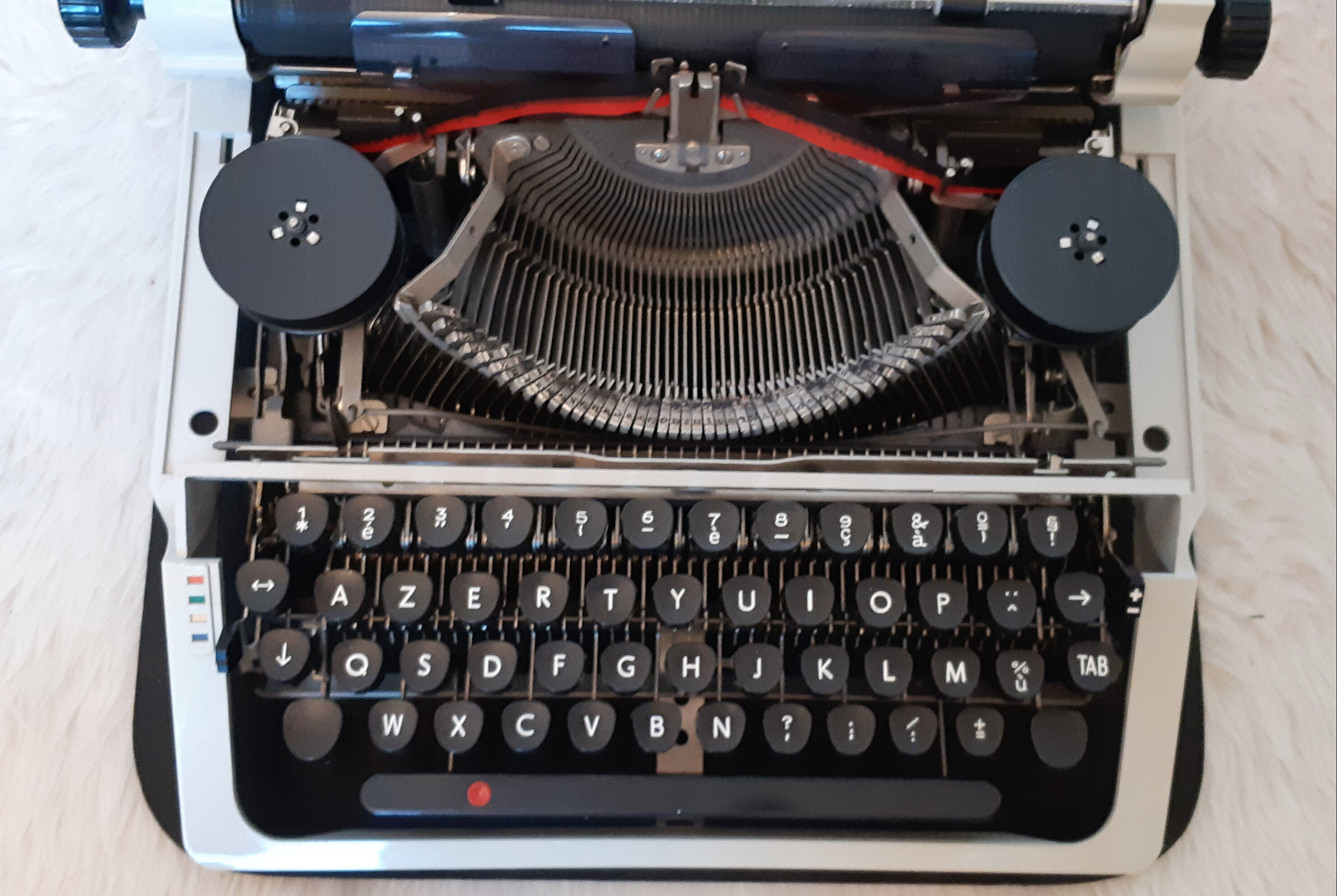 Portable, functional typewriter with user manual