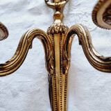 French Empire-style wall sconce or chandelier in bronze with an antique gold patina.