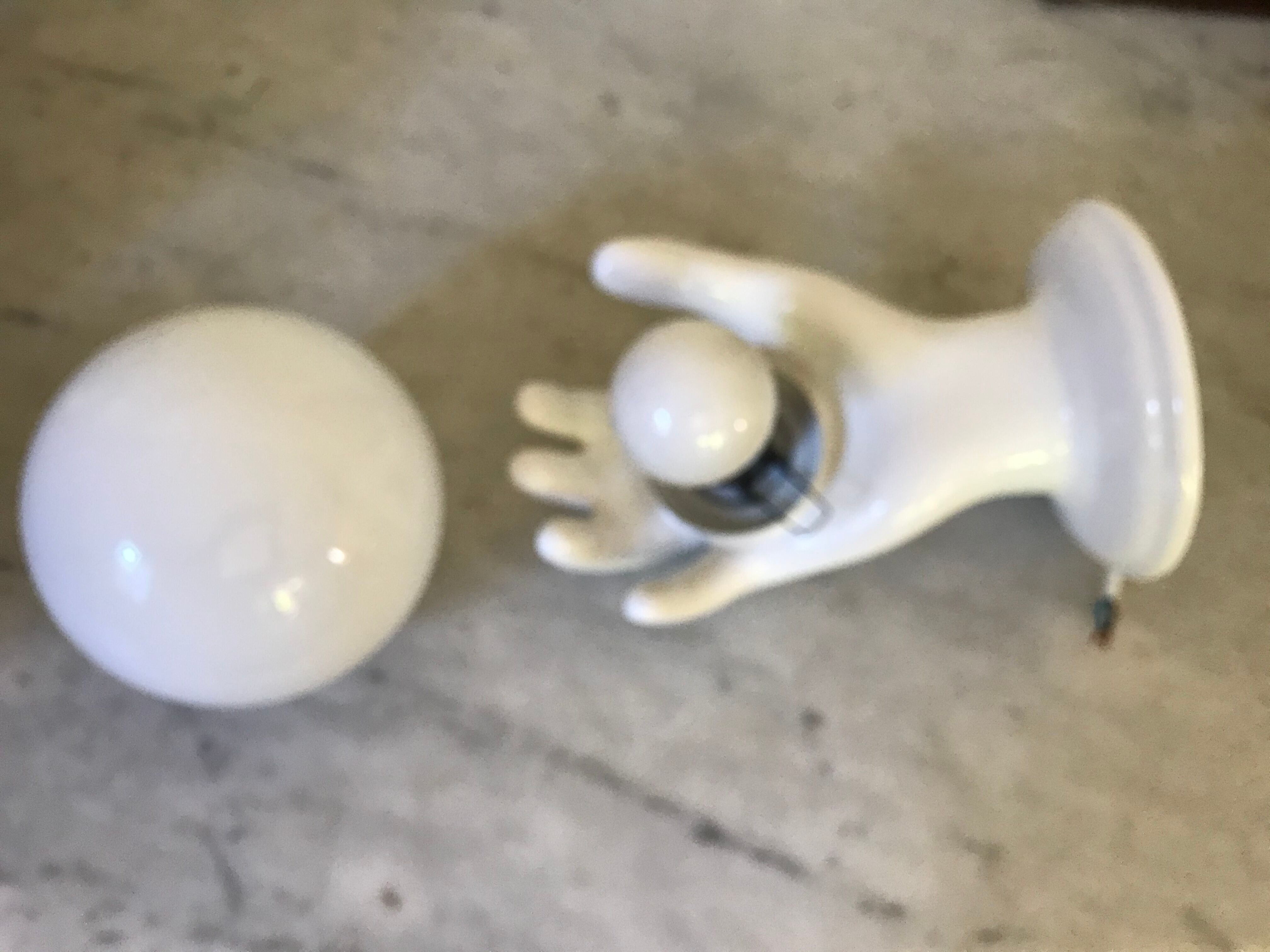 Ceramic hand and opaline sconce