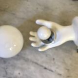 Ceramic hand and opaline sconce