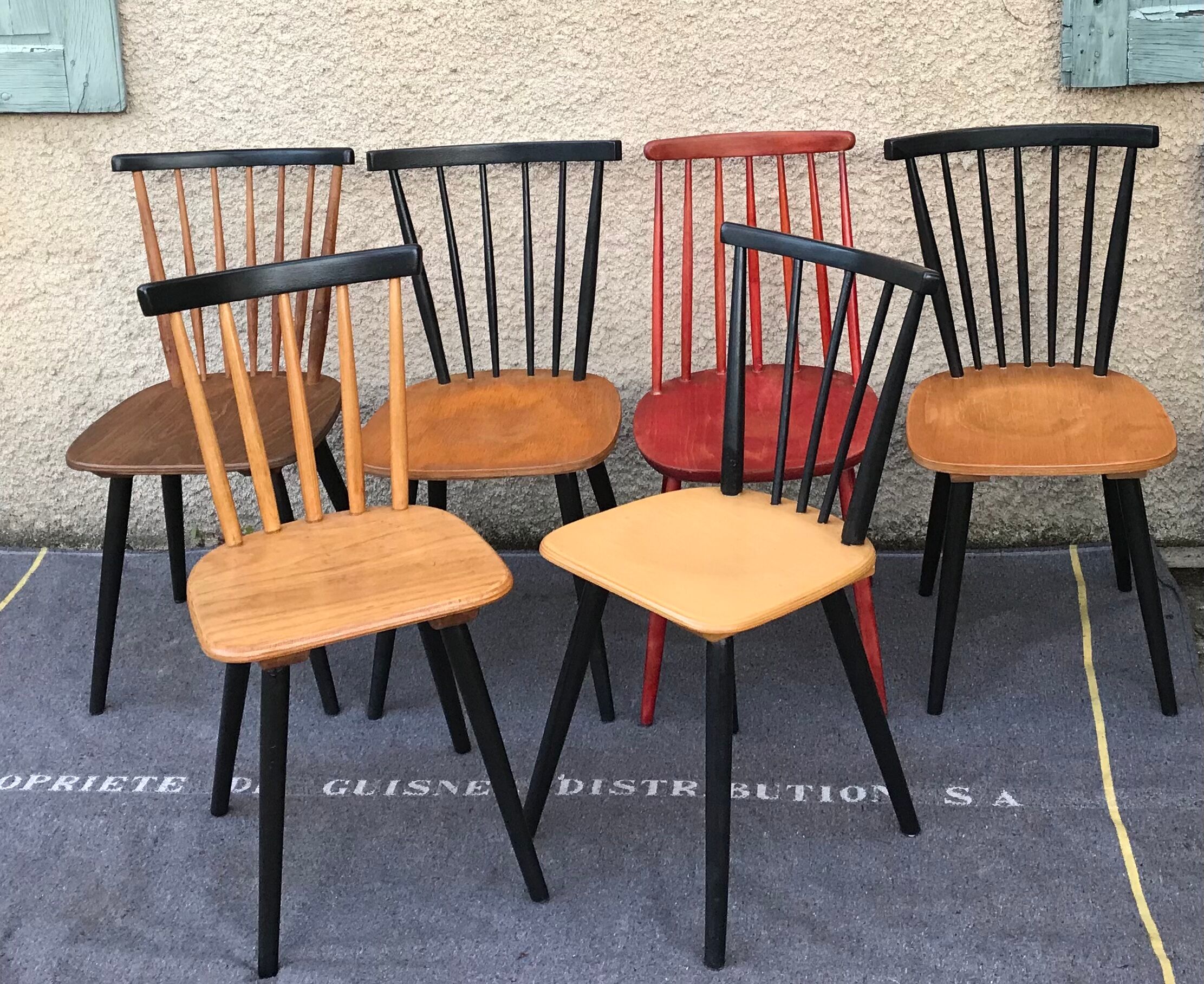 Set of 6 mismatched vintage chairs with bars and compass legs