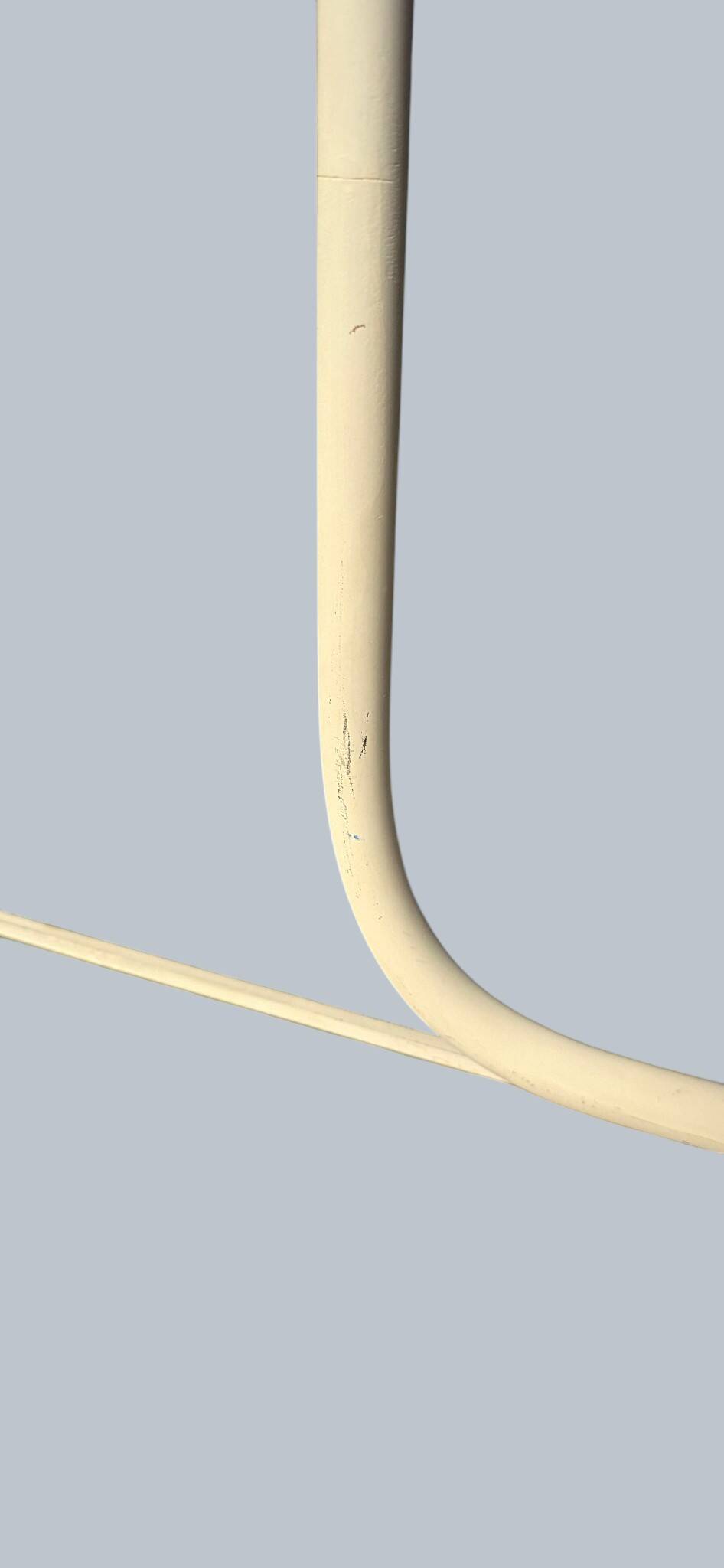 Minimalist metal wall light in the style of Jean Prouvé, circa 1950.