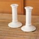 Pair of cream ceramic candlesticks