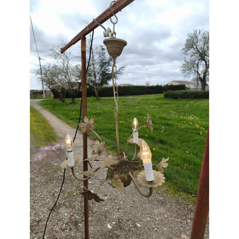 Vintage gold metal chandelier with floral decoration.