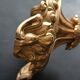 Antique three-light openwork brass church candelabrum.