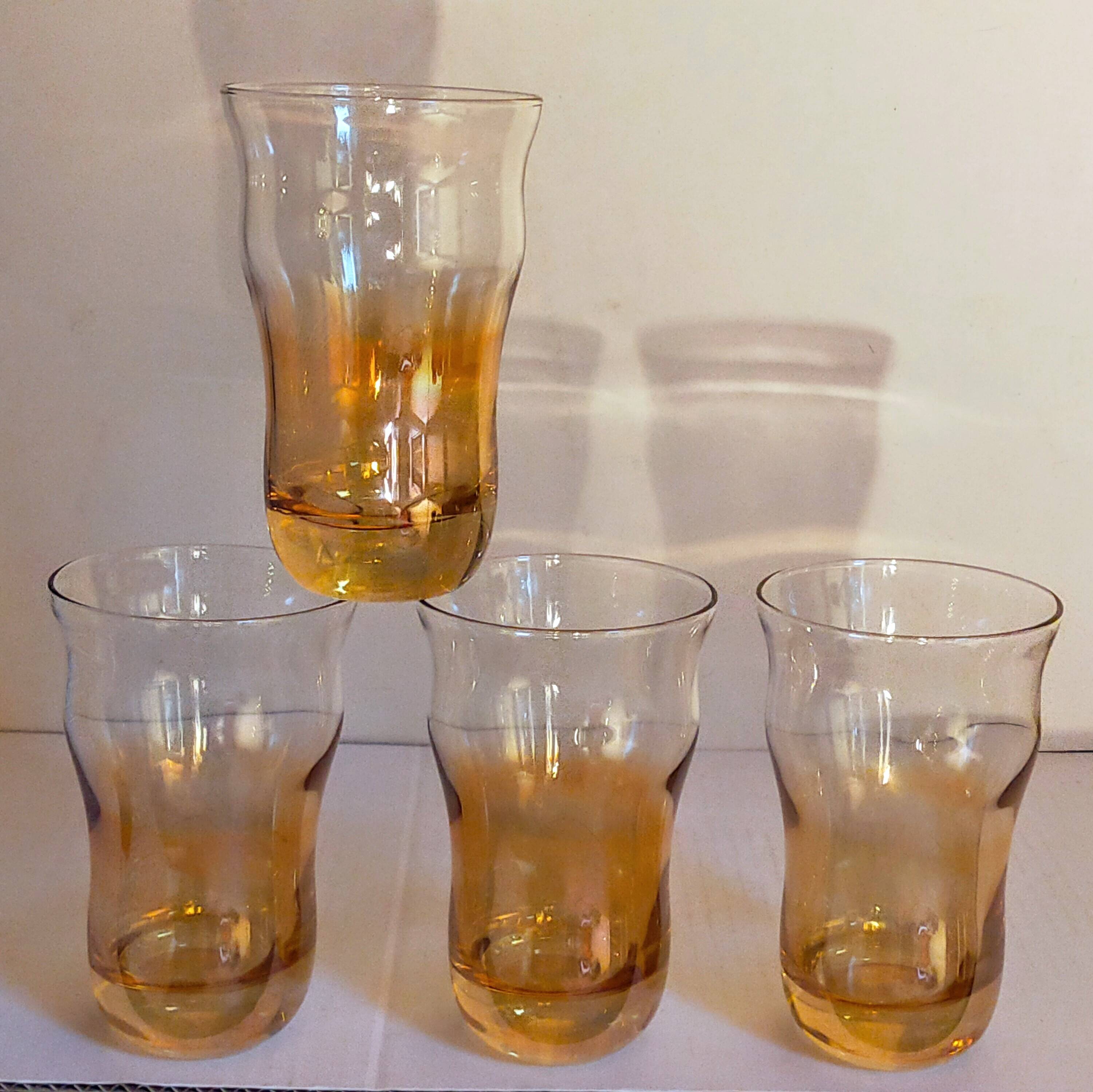 Four iridescent honey blown glass glasses