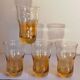 Four iridescent honey blown glass glasses