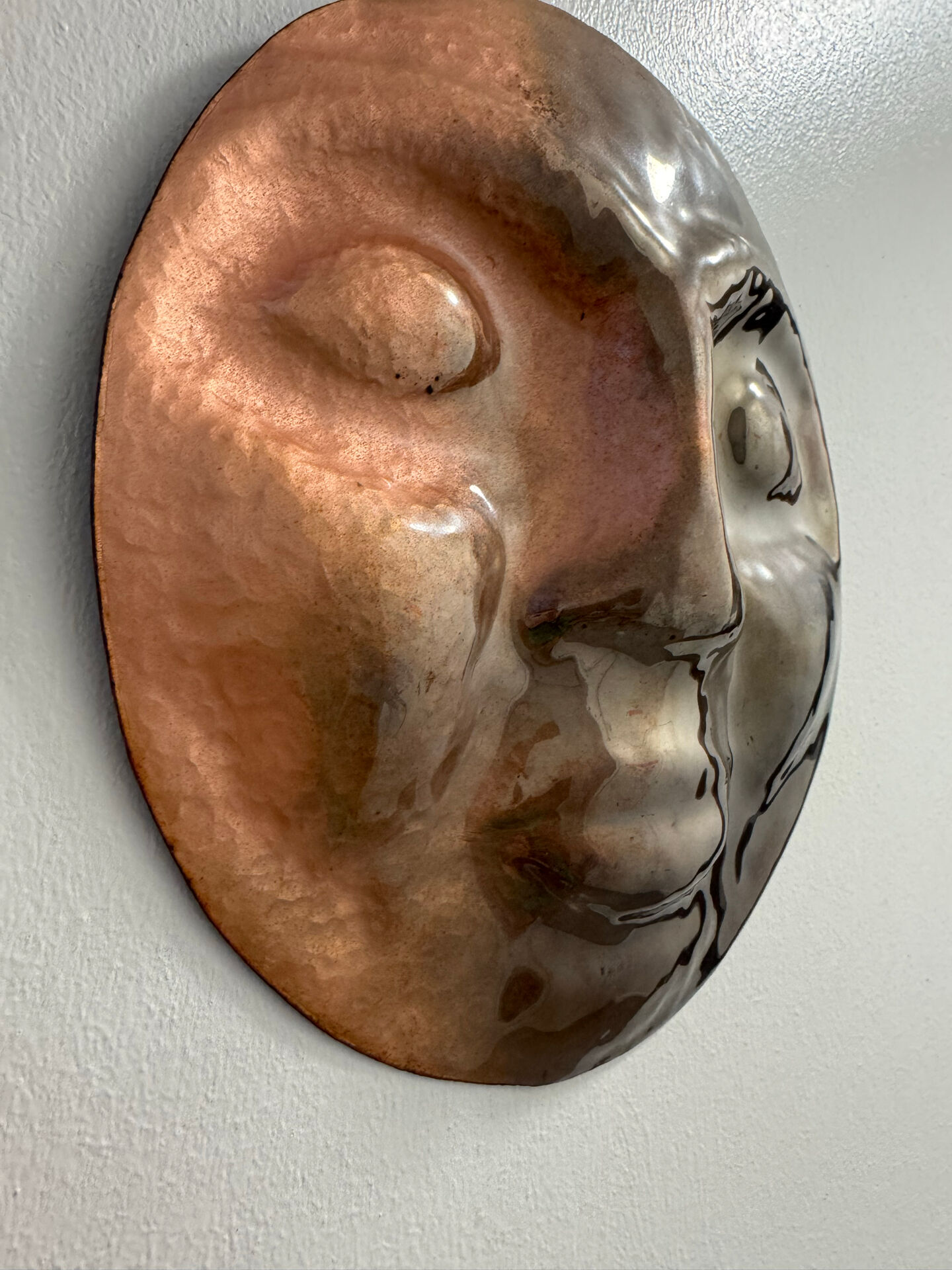 Sculpture face in embossed enamelled brass from the 1960s.