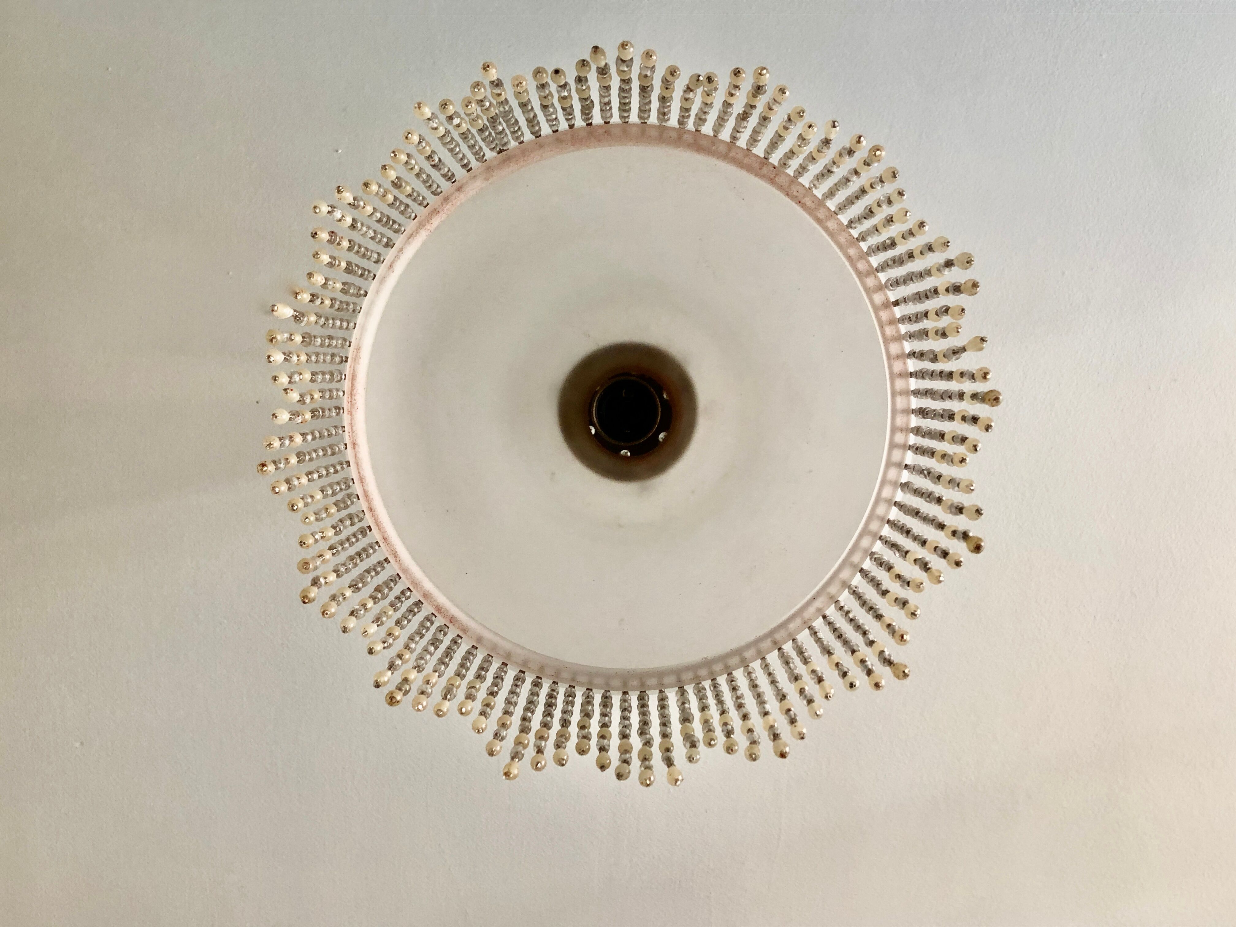 Pink half-shell suspension with pearl fringe