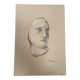Signed drawing, charcoal study of a woman's face for workshop plaster.