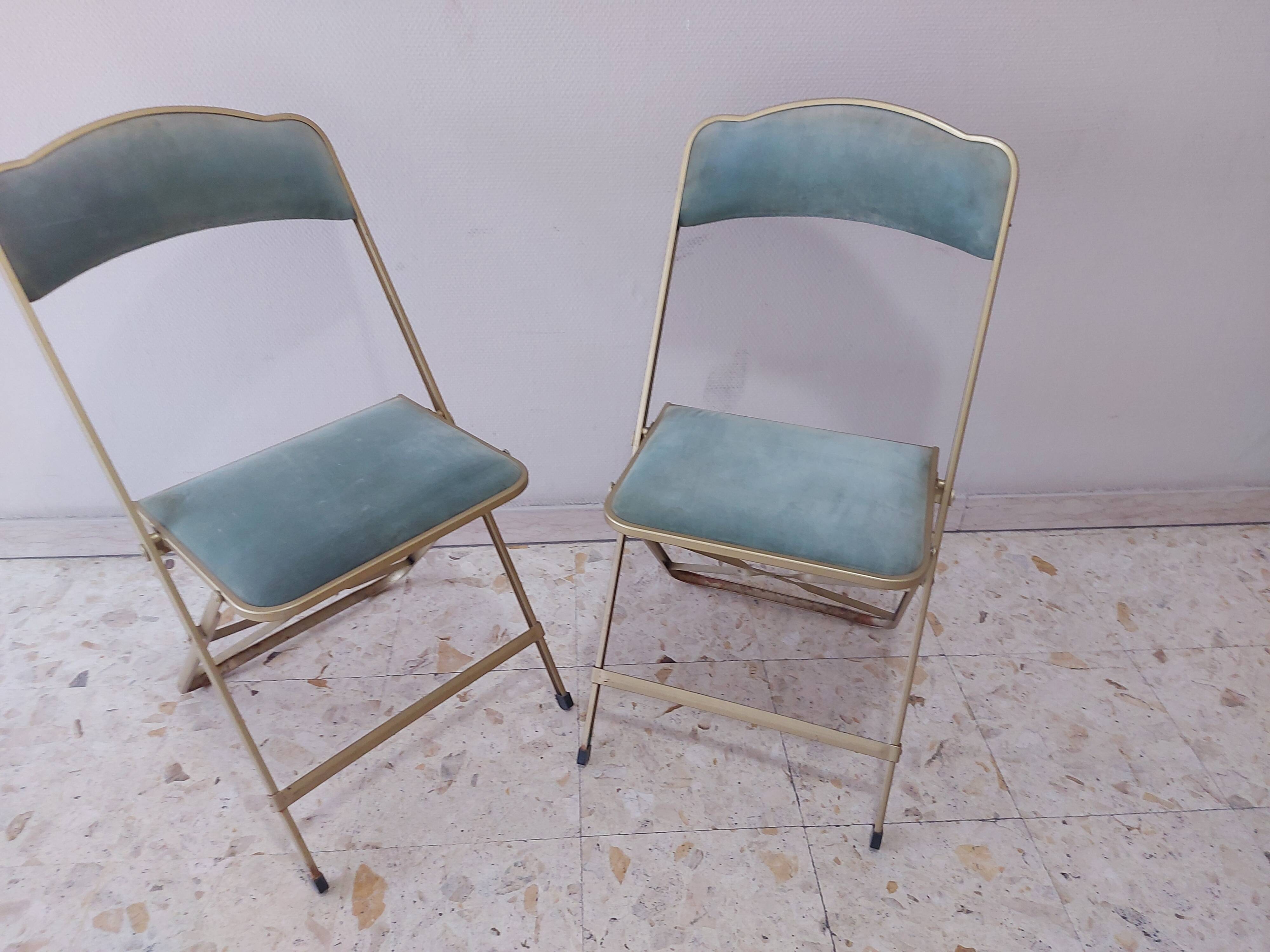 Two folding opera chairs in velvet
