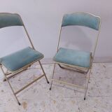 Two folding opera chairs in velvet