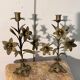 Pair of church candlesticks in bronze with floral decorations.
