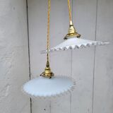 Duo of serrated opaline suspensions