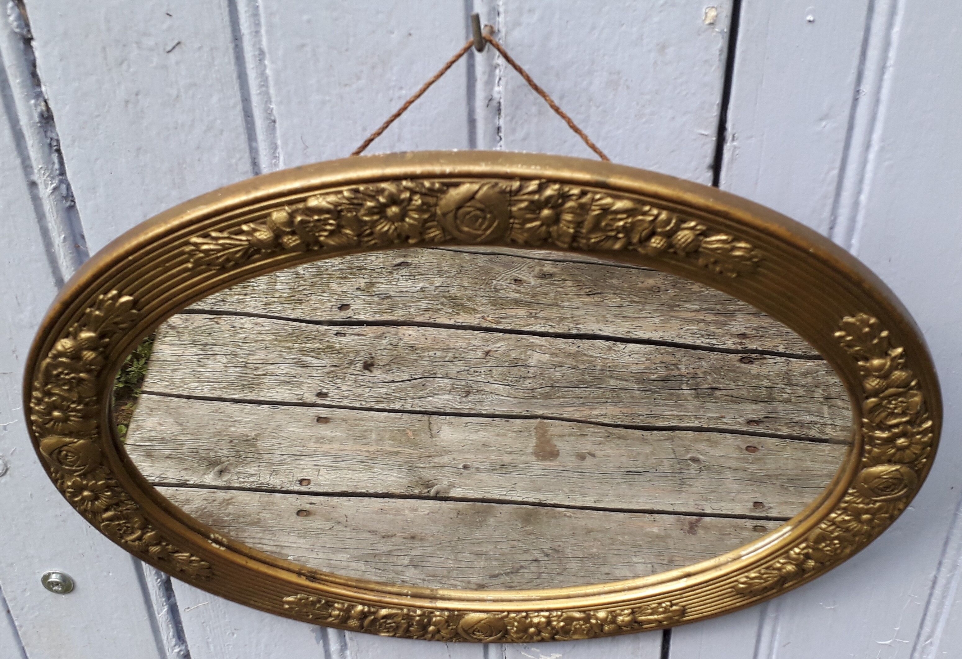 Oval mirror in plaster and art deco wood 36 x 46 cm