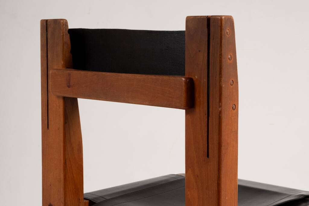 Pierre Chapo. Series of 8 "S11" chairs in elm and leather. 1960s-70s.