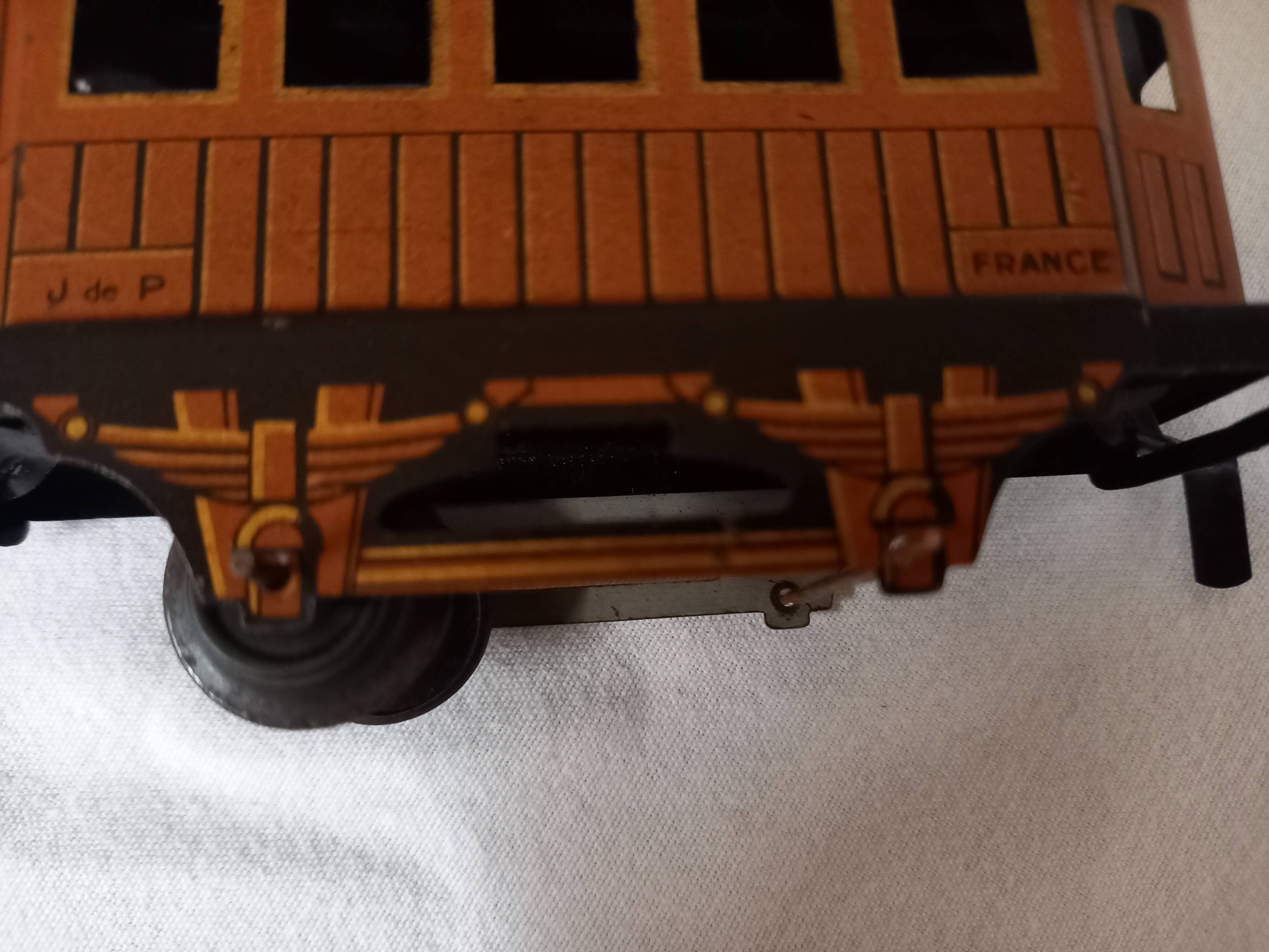 Small JEP mechanical train, including locomotive, tender, sleeping car, rail, 1930s