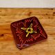 Vintage ceramic trivet with a 70s pattern.