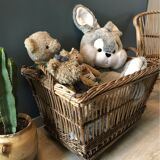 Rattan laundry basket on vintage wheels