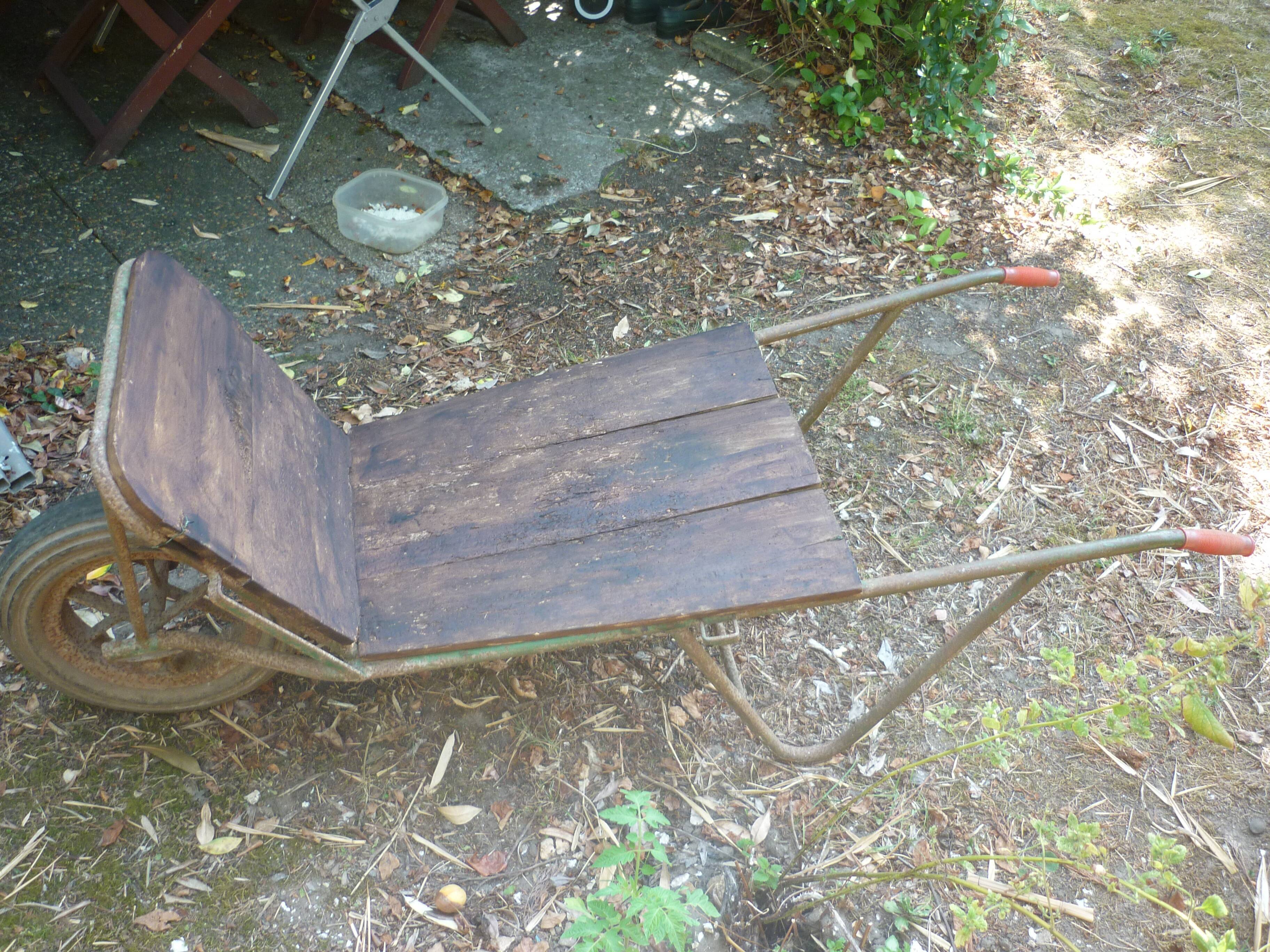 Former wooden and metal wheelbarrow