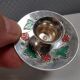 Silver-plated candle holders with inlaid red and green enamel