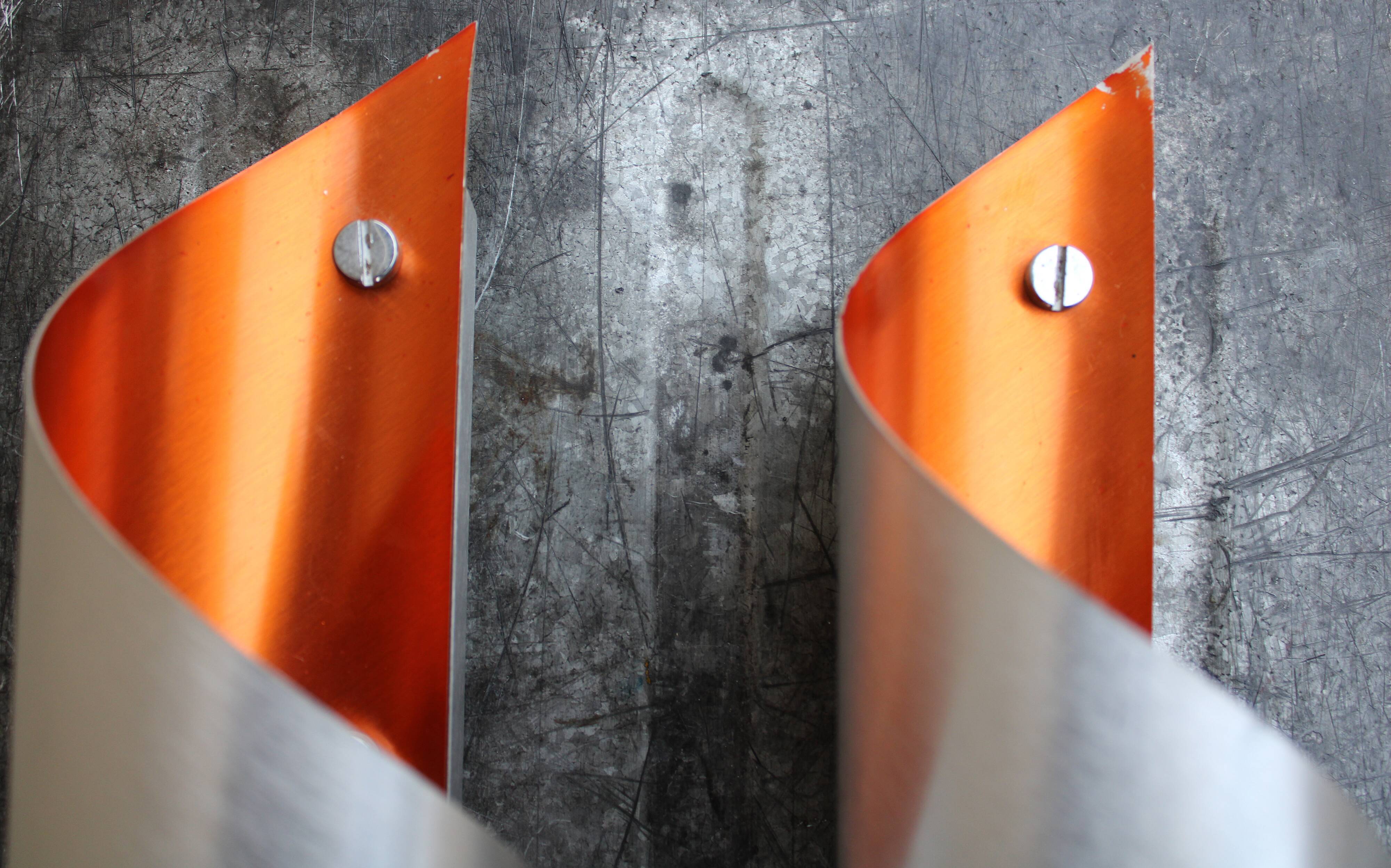 Pair of orange brushed aluminum wall light