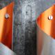 Pair of orange brushed aluminum wall light
