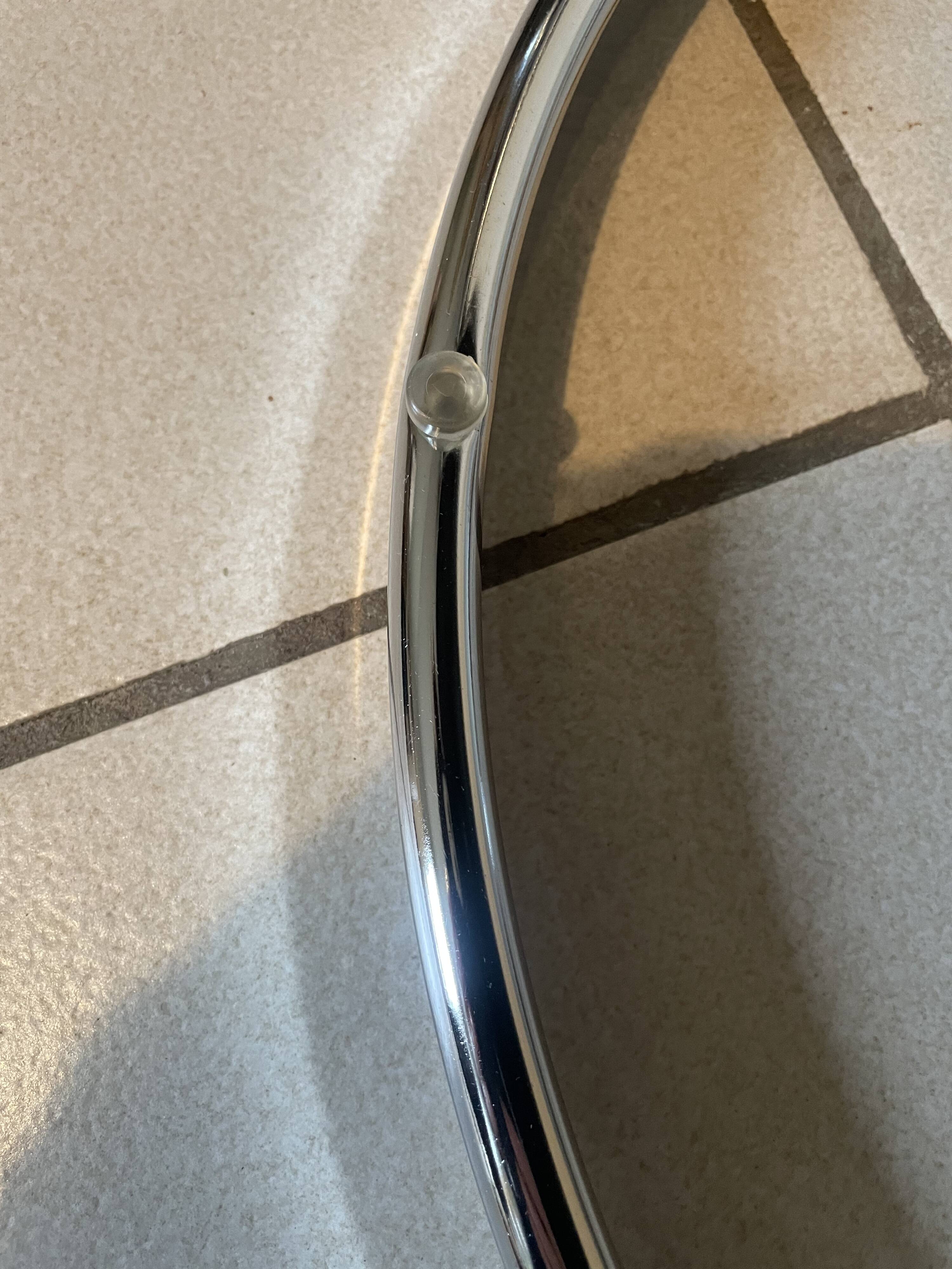 Coffee table with 3 chrome and smoked glass tops.