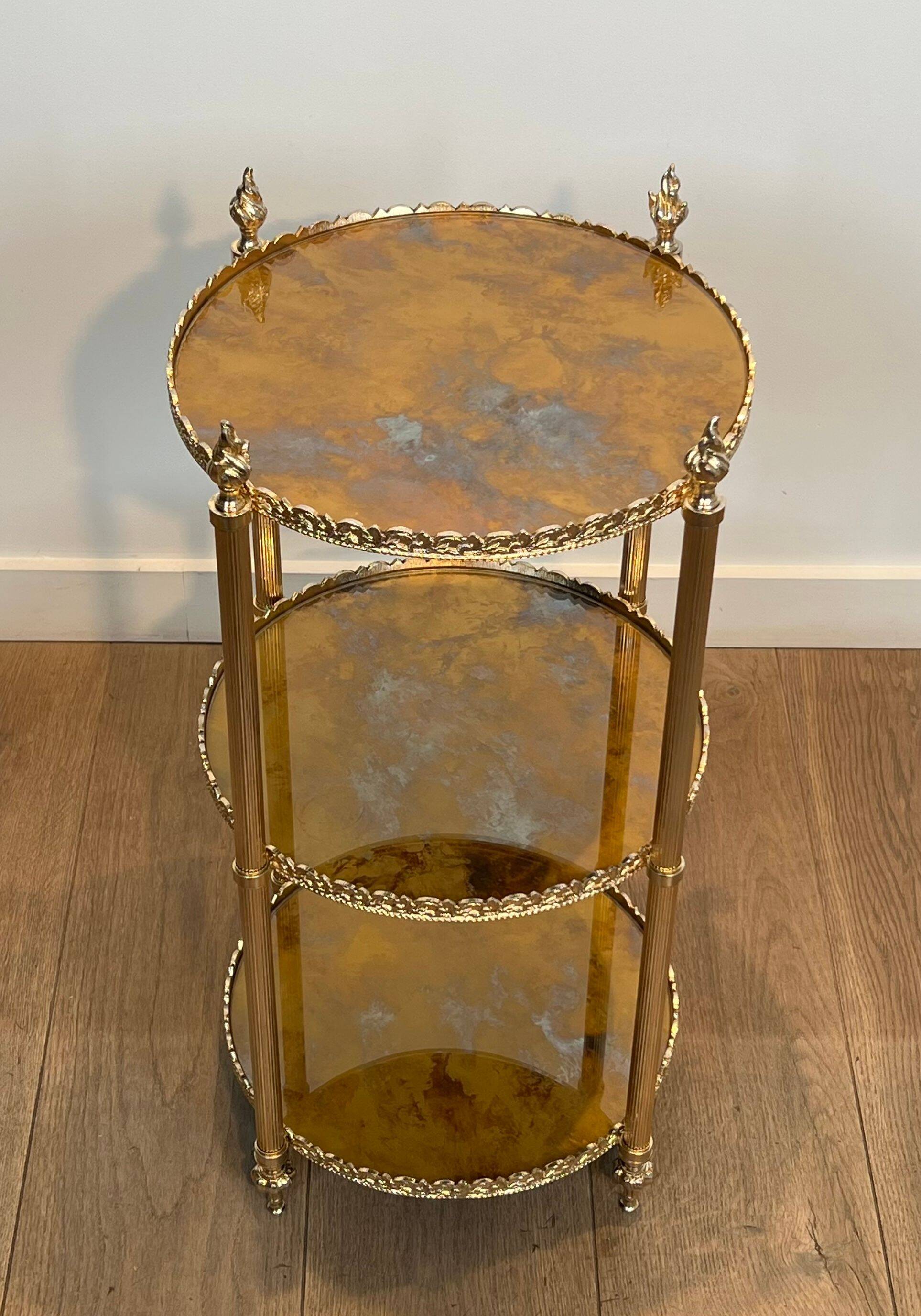 Round silver-plated brass table with triple eglomisé mirror tops from Maison Jansen.