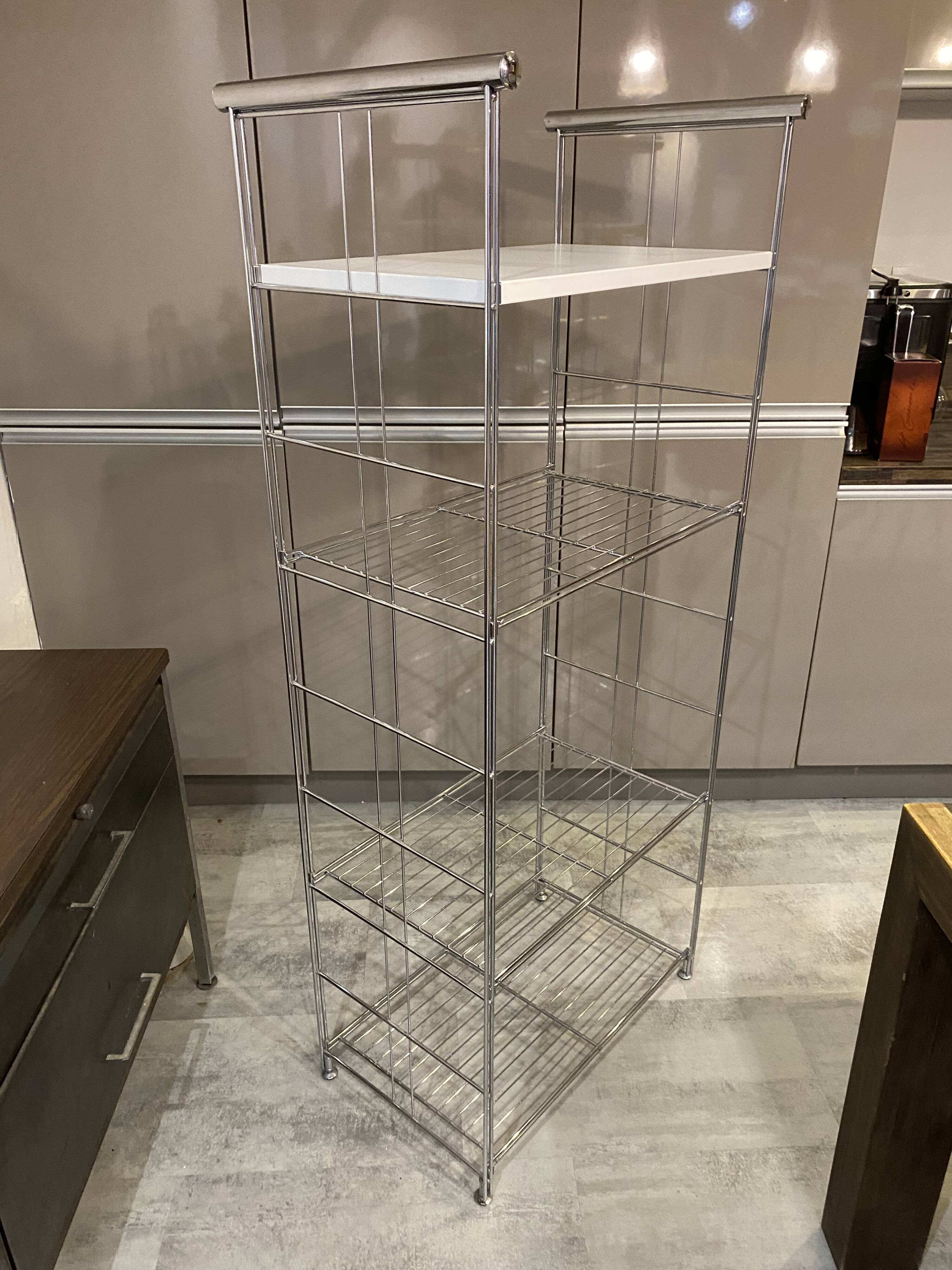 Modular wall bookshelf desk in vintage chrome.