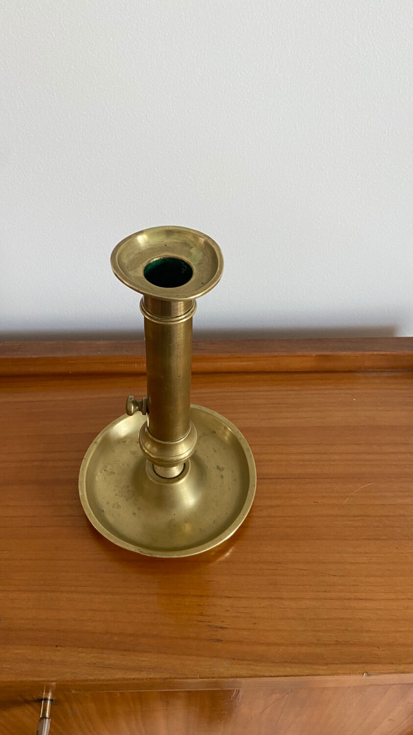 Antique brass push candle holder
