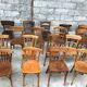 Set of 15 mismatched curved wood bistro chairs
