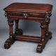 Ancient Flemish Gothic desk. Solid oak with richly carved dolphins.