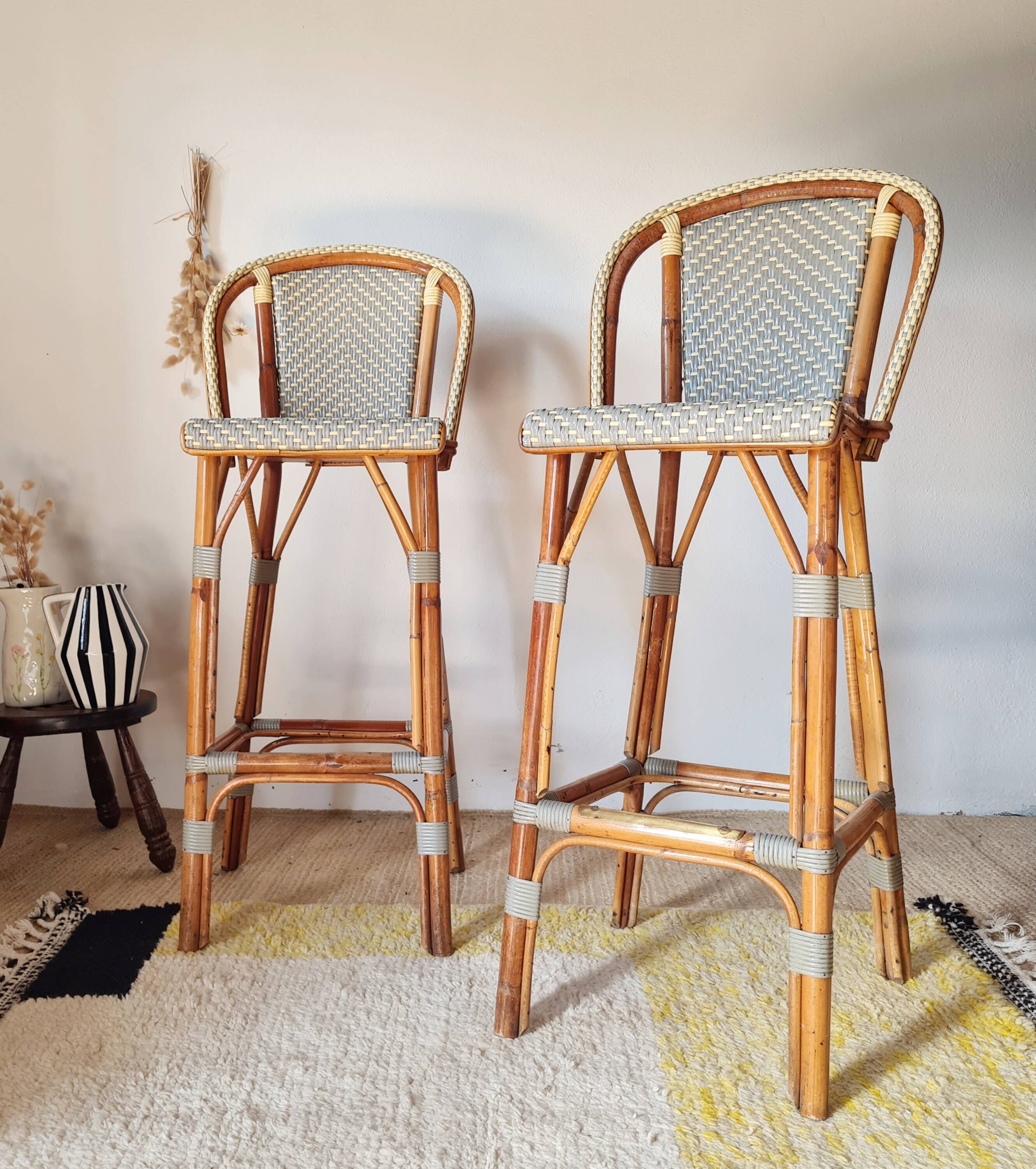 Pair of vintage Gatti bar stools in two-tone rattan and caning.