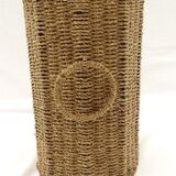 Braided straw wastepaper basket.