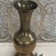 Golden brass vase chiseled vintage floral pattern