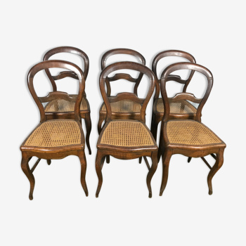 Suite de 6 chaises Louis Philippe en noyer et cannage 19eme