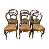 Suite de 6 chaises Louis Philippe en noyer et cannage 19eme