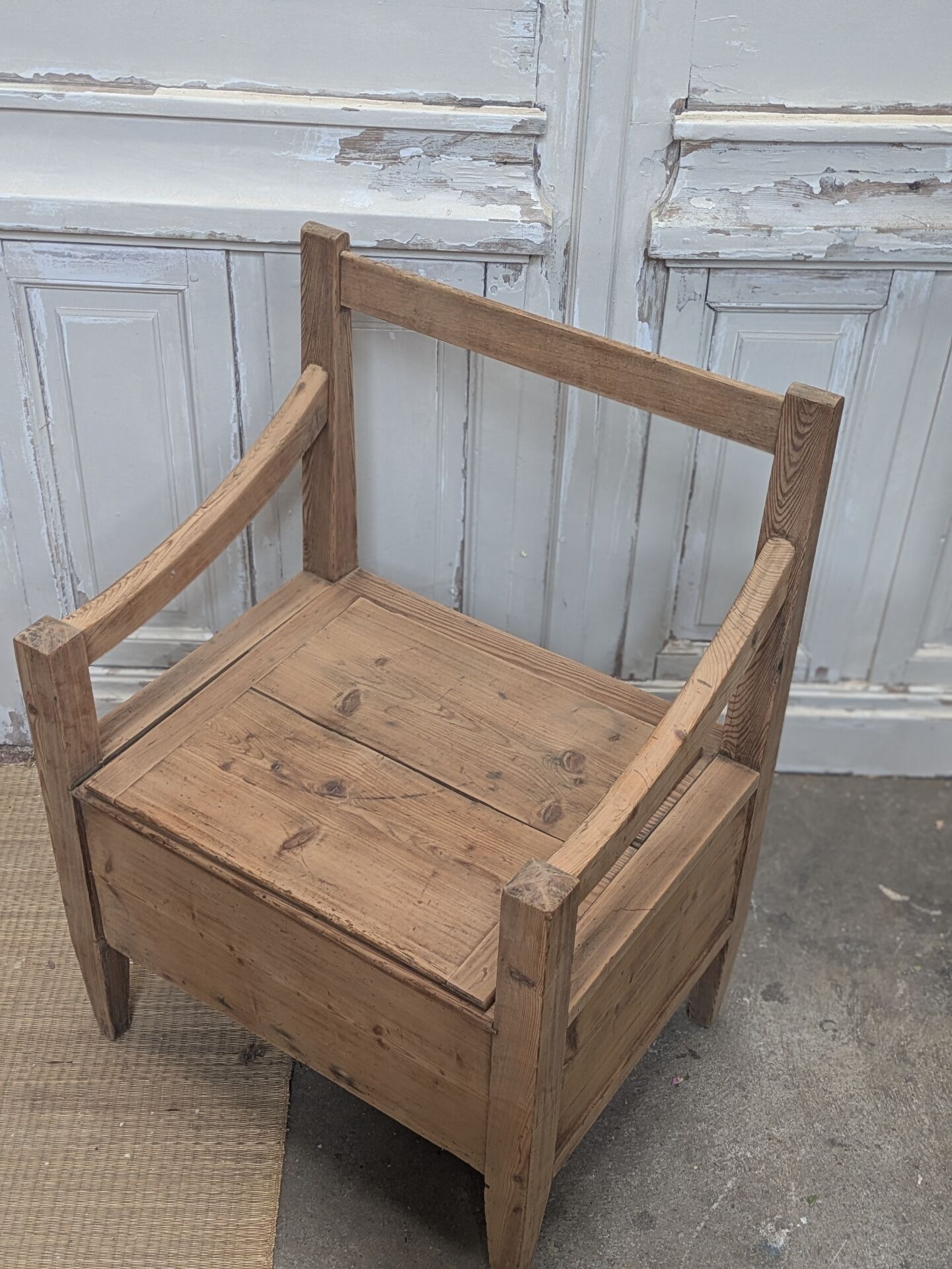 Antique armchair in raw wood