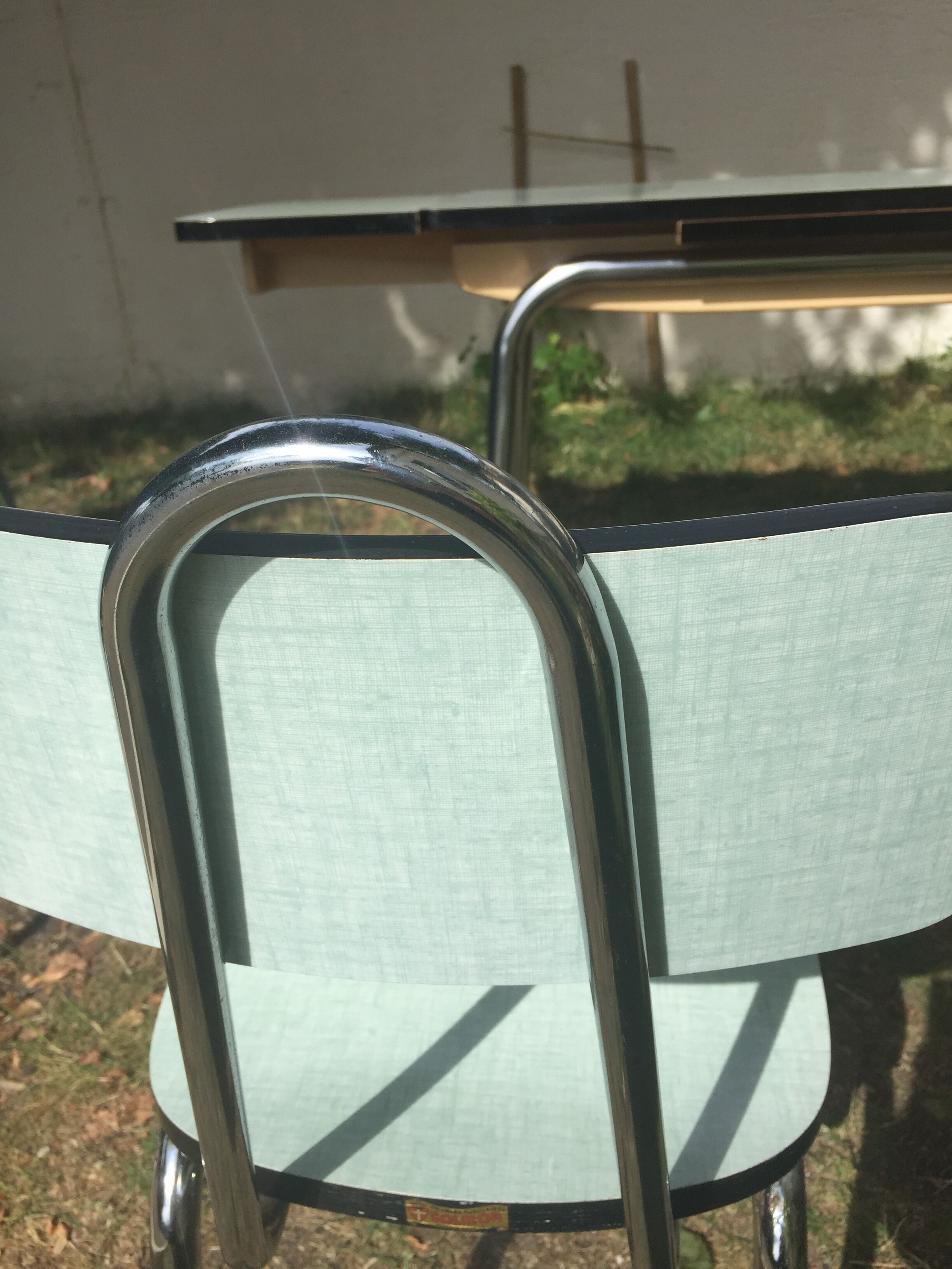 Table and 4 green water formica chairs 60's
