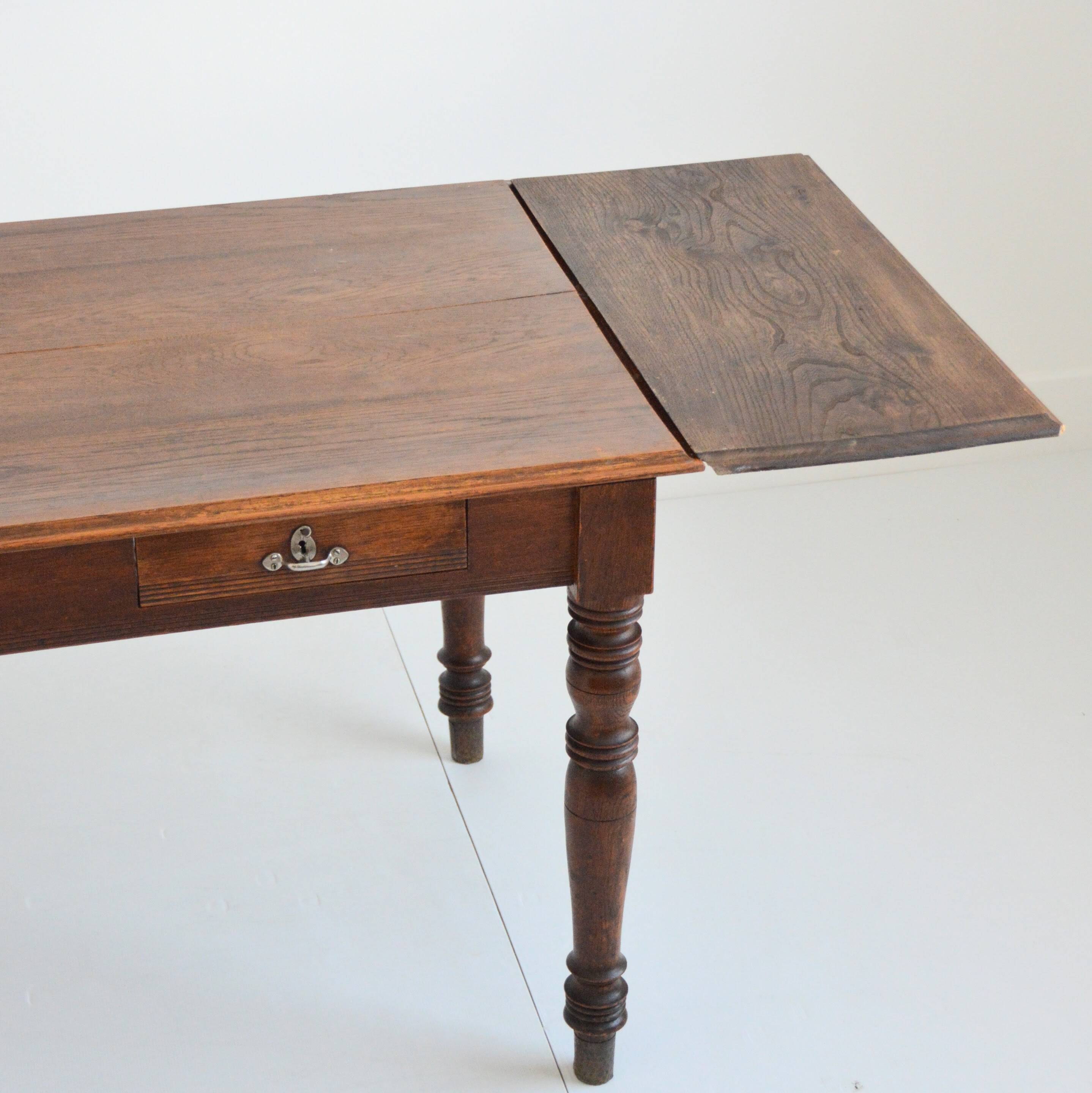 Farm table with extensions from the early 20th century.