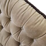 Vintage beige two-seater canapé with fringes.