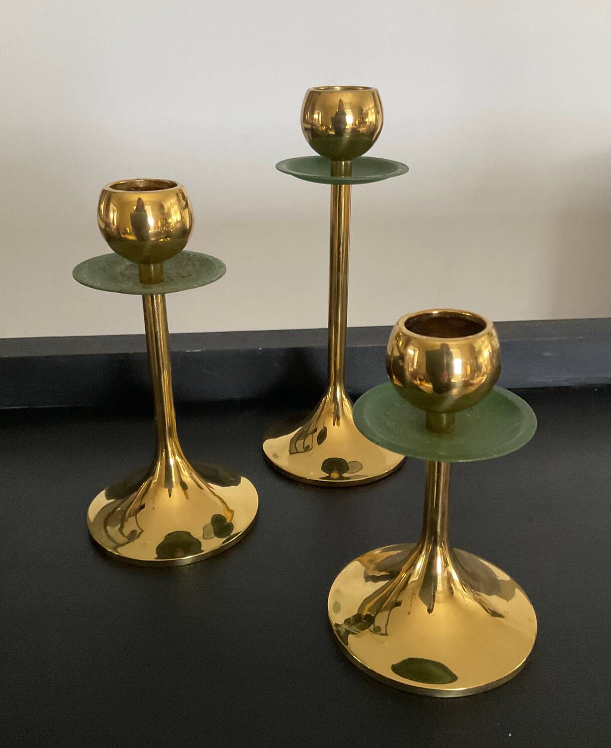 Trio of vintage brass candlesticks