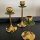 Trio of vintage brass candlesticks