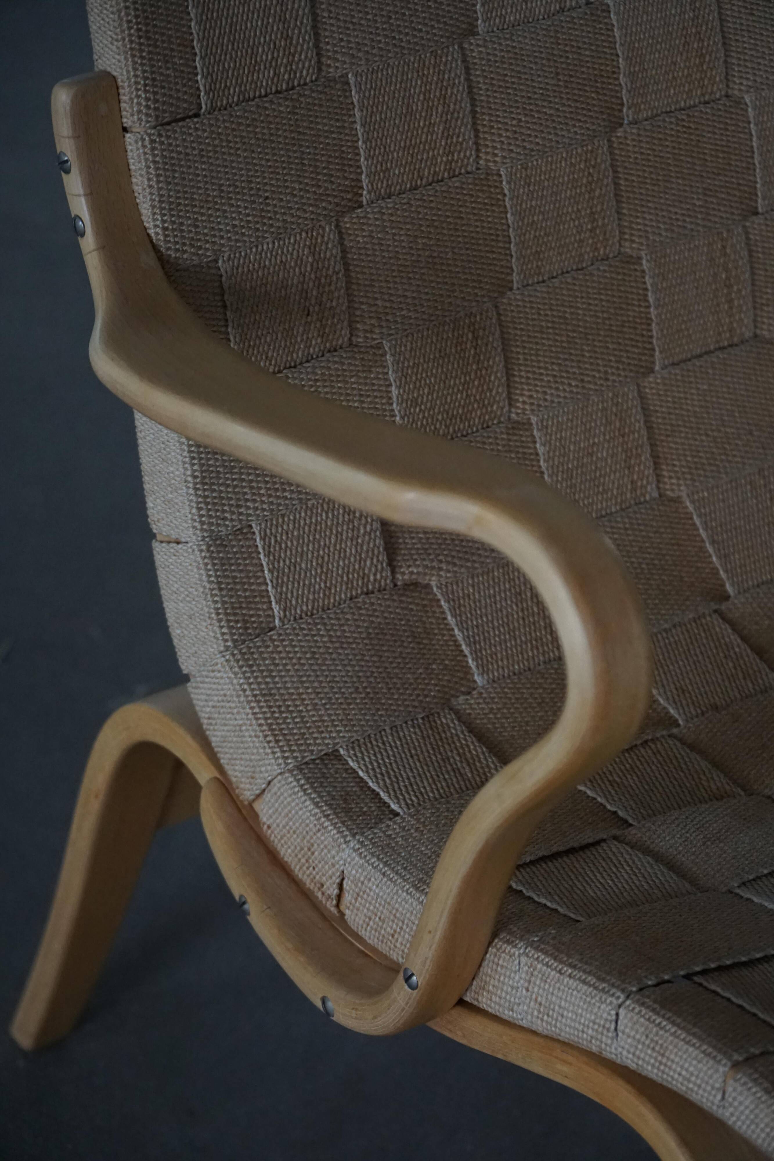 Pair of Swedish armchairs from the mid-century by Bruno Mathsson, model "Eva", 1960s.