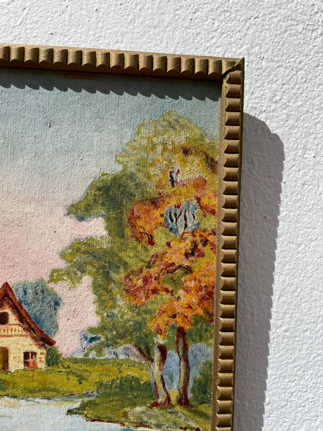 Small landscape painting with golden frame