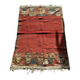 Small wool rug, predominantly red with geometric patterns