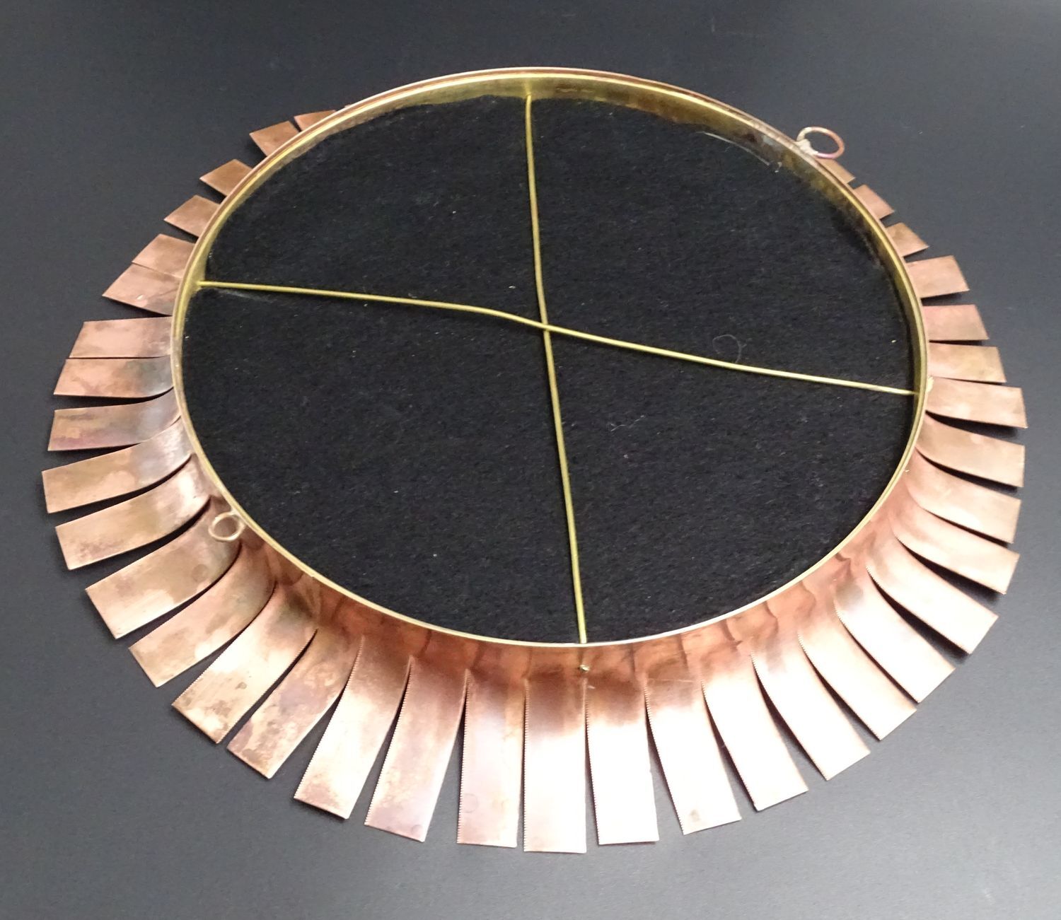 Round mirror in cut copper, sun-shaped  1970